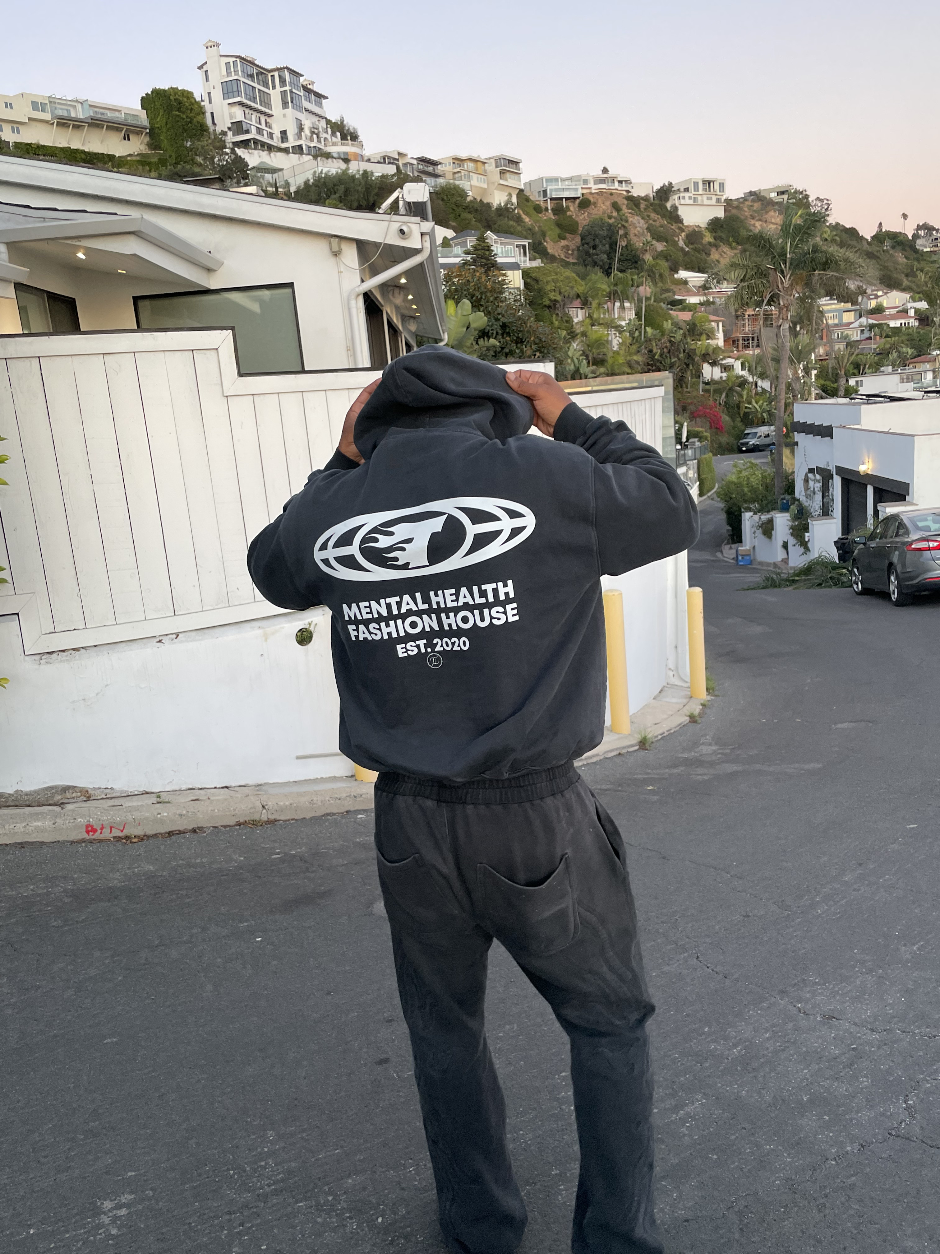 Back graphic of the charcoal Tuff Love hoodie
